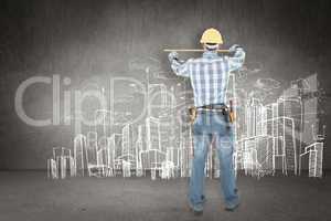 Composite image of rear view of construction worker using measur