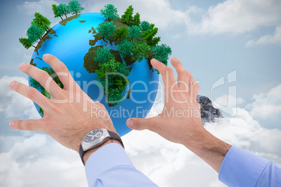 Composite image of businessman holding something with his hands