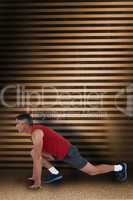 Composite image of fit man stretching his legs