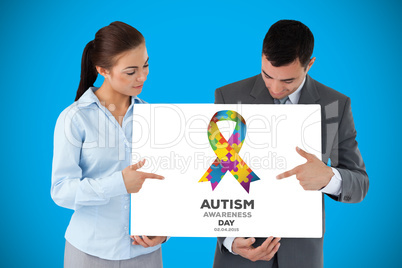 Composite image of business partners pointing at sign they are p