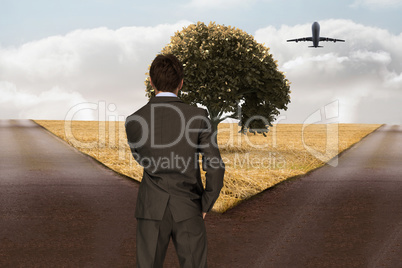 Composite image of thinking businessman