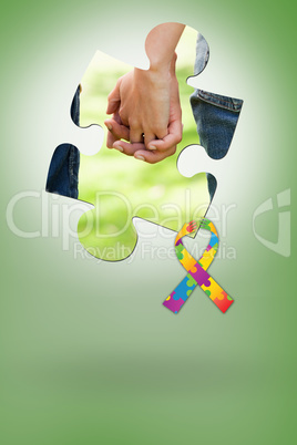 Composite image of two friends holding hands