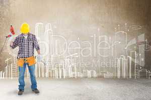 Composite image of male repairman holding drill machine and hamm