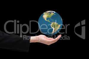 Composite image of businesswomans hand presenting