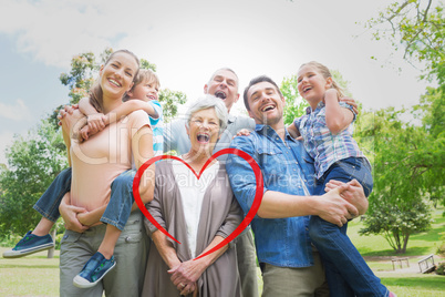 Composite image of portrait of cheerful extended family at park