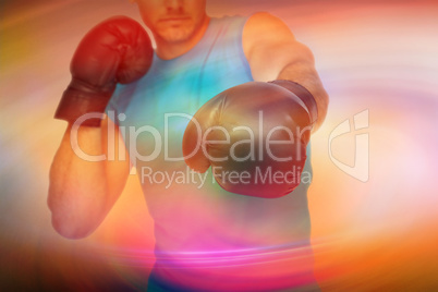 Composite image of close-up of a determined male boxer focused o
