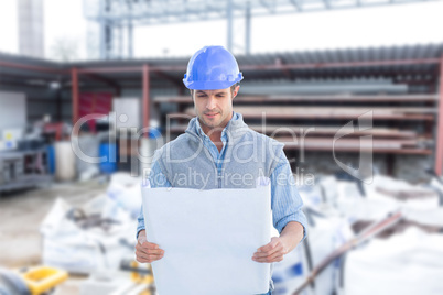 Composite image of architect reading blueprints