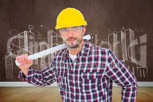 Composite image of handyman holding rolled up blueprint