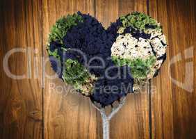 Composite image of heart shaped earth tree