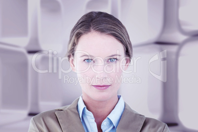 Composite image of businesswoman looking at the camera