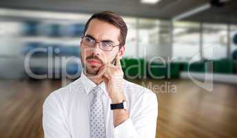 Composite image of portrait of a businessman with glasses thinki