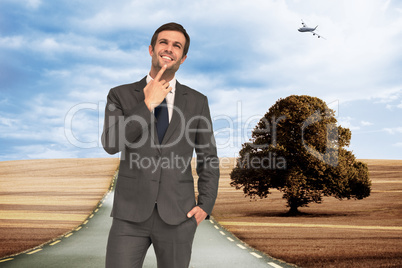 Composite image of thinking businessman