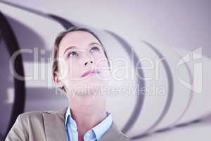 Composite image of thoughtful businesswoman in suit