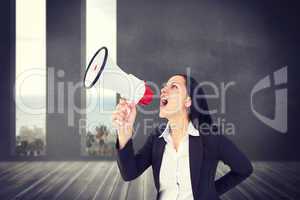 Composite image of pretty businesswoman shouting with megaphone