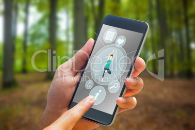 Composite image of hand holding smartphone