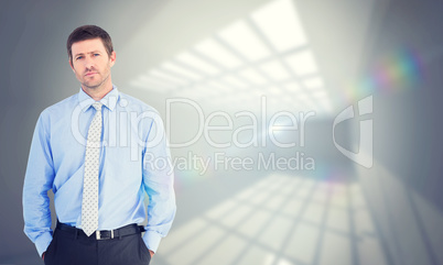 Composite image of businessman looking at the camera