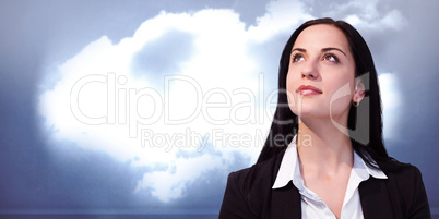 Composite image of pretty businesswoman looking up