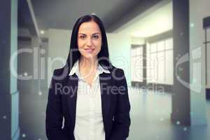 Composite image of pretty businesswoman smiling at camera