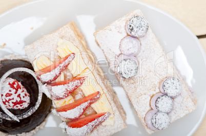 selection of fresh cream cake dessert plate