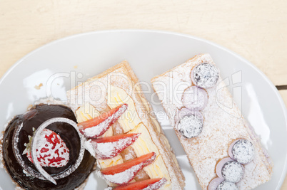 selection of fresh cream cake dessert plate