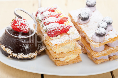 selection of fresh cream cake dessert plate