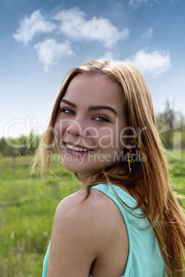 Portrait of a young sensual blonde outdoors