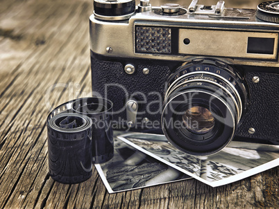 old vintage camera closeup on wooden background