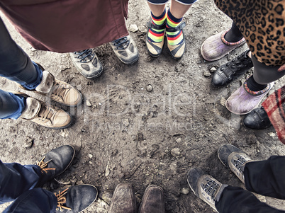 feet of people standing in a circle