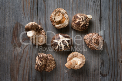 Shiitake mushrooms on wood background