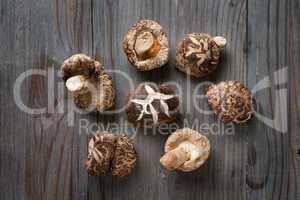 Shiitake mushrooms on wood background