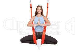 Young woman doing anti-gravity aerial yoga