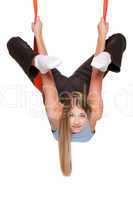 Young woman doing anti-gravity aerial yoga