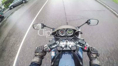Biker rides on the road in the city - time lapse