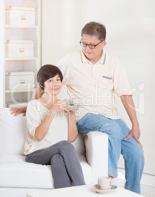 Asian senior couple relaxing at home