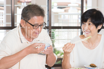 Asian Senior Couple Eating