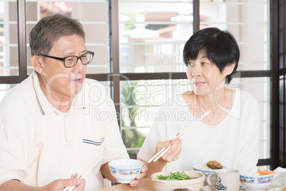 Senior couple having meal