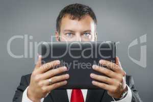 business man reading tablet pc