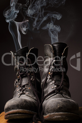 Old boots with smoke