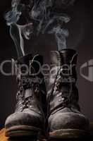 Old boots with smoke