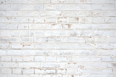 Steinwand mit weißen Backsteinen
