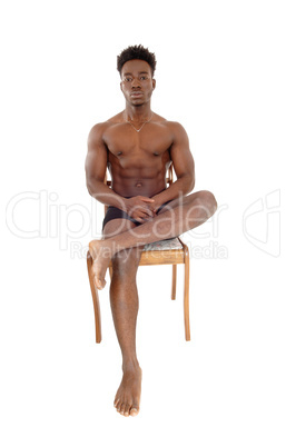 Young black man on chair.
