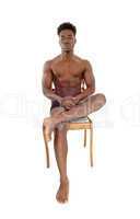 Young black man on chair.