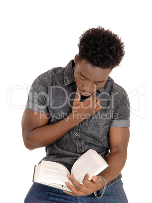 Black man reading book.