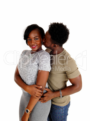 Black man kissing girlfriend.