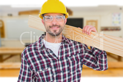 Composite image of handyman holding wood planks