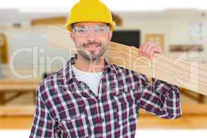 Composite image of handyman holding wood planks
