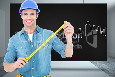 Composite image of male architect holding tape measure