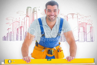 Composite image of worker using spirit level