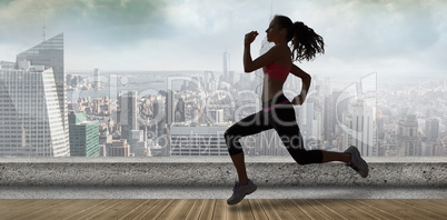 Composite image of full length of healthy woman jogging