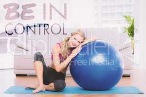 Composite image of toned blonde sitting beside exercise ball smi